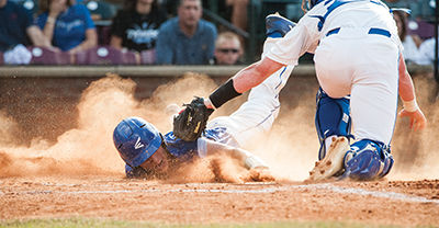 Ryan Gibson attempts to slide into home